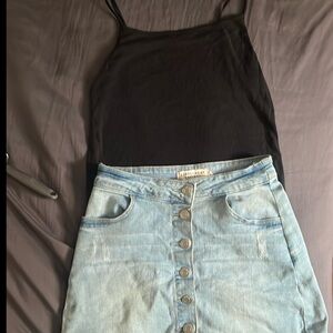 Black tank top and light blue washed denim skirt